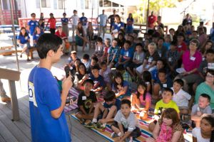 Tanner addressing the faculty and student body